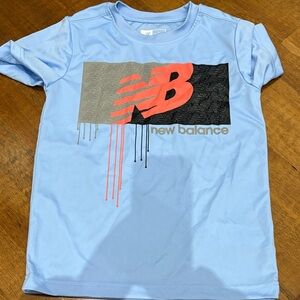 New Balance Light Blue Tee with Red and Black Graphic